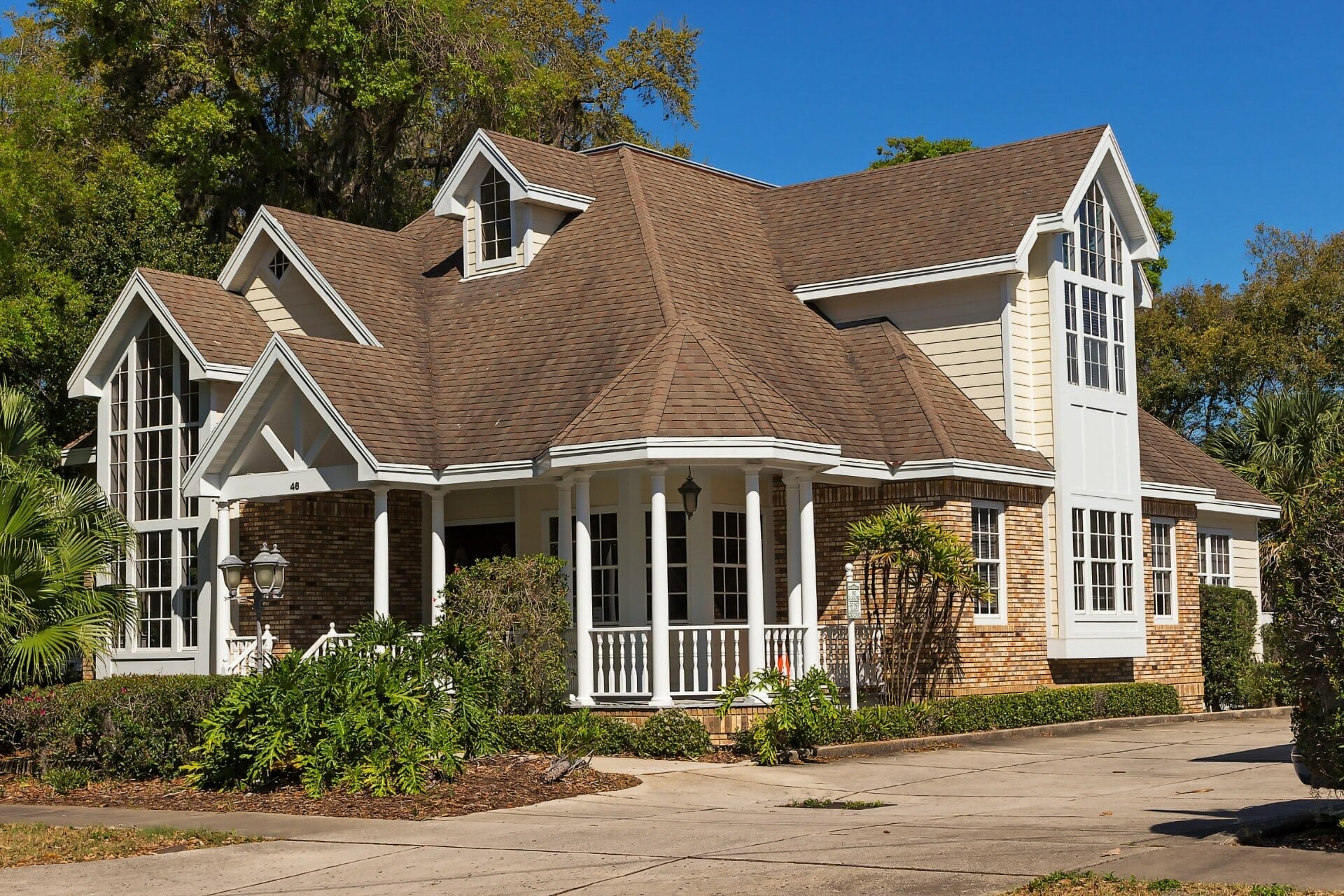 Large shingle-style suburban home with gabled roof